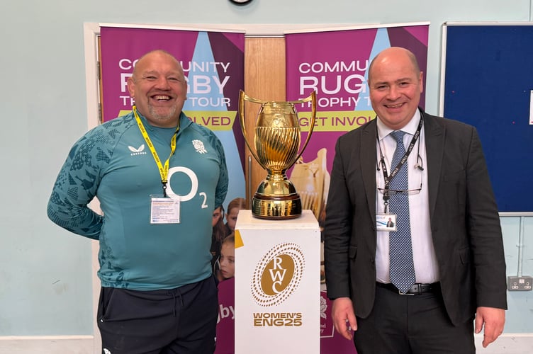 Wayne Reed from the RFU and Chulmleigh College Head Teacher Neil Payne with the Women’s Rugby World Cup Trophy. AQ 7362