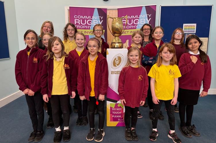 Some of the East Worlington Primary School girls with the Women’s Rugby World Cup Trophy. AQ 7383
