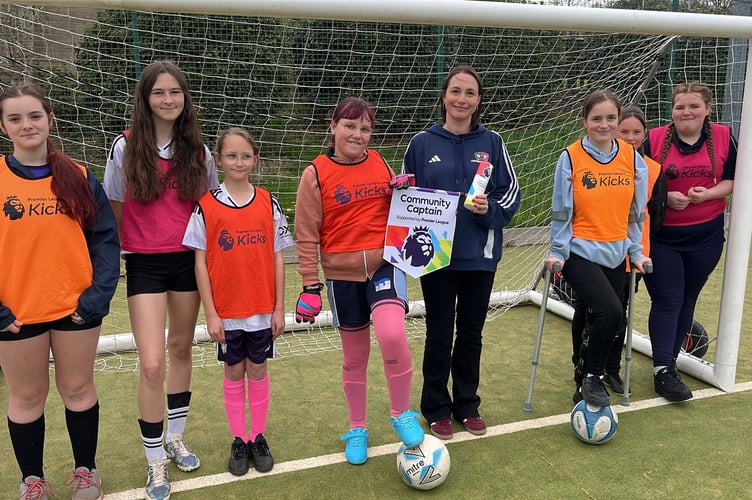 Laura Evans, fifth left, who has been named Exeter City's Premier League Community Champion.
