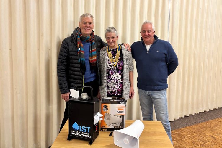 Paul Butt from Crediton Rotary Club, left, presented a starting system to Crediton Swimming Club.
