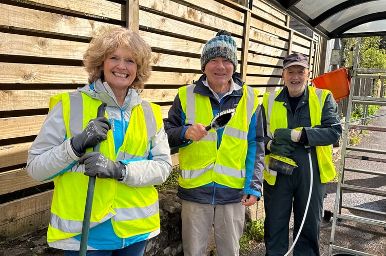 Copplestone Spring Clean and Litter Pick organiser Suzanne Lunn with those who cleaned the bus shelter.  AQ 8094
