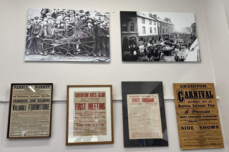 Prints and picture from times past adorn Crediton Museum walls.  AQ 8179
