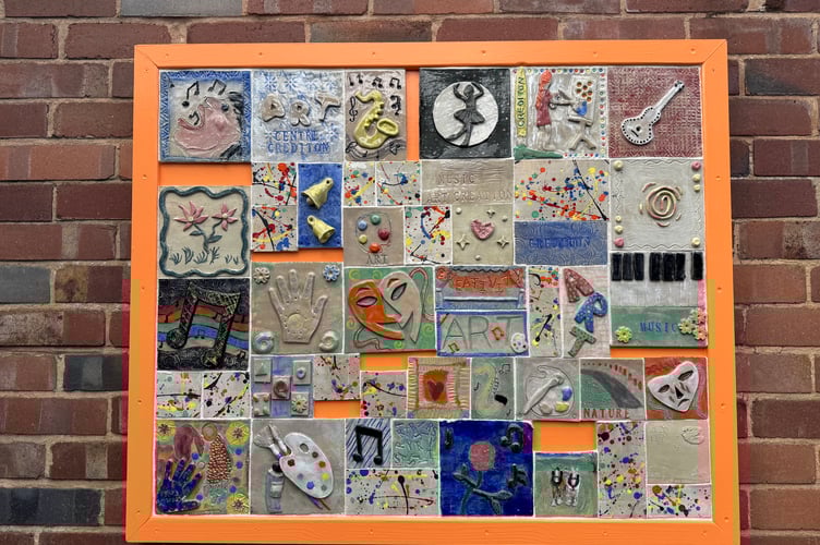 The tiles now on display at the entrance to Crediton Arts Centre.  AQ 8073
