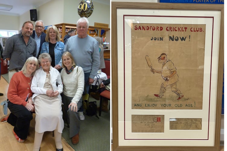 Margaret and some of her family and the framed picture.
