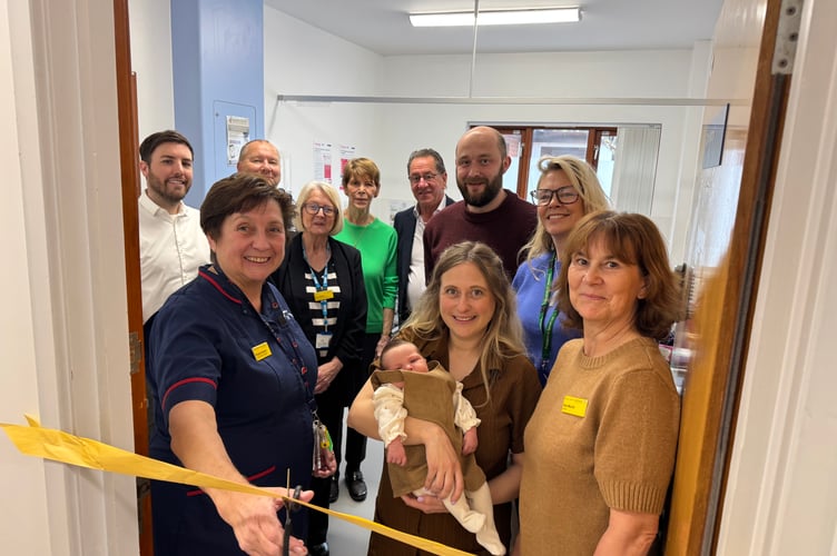 Pauline Bonner, Clinical Midwifery Manager, left, cut the ribbon to officially open the new midwifery room at Crediton Hospital.  AQ 8375
