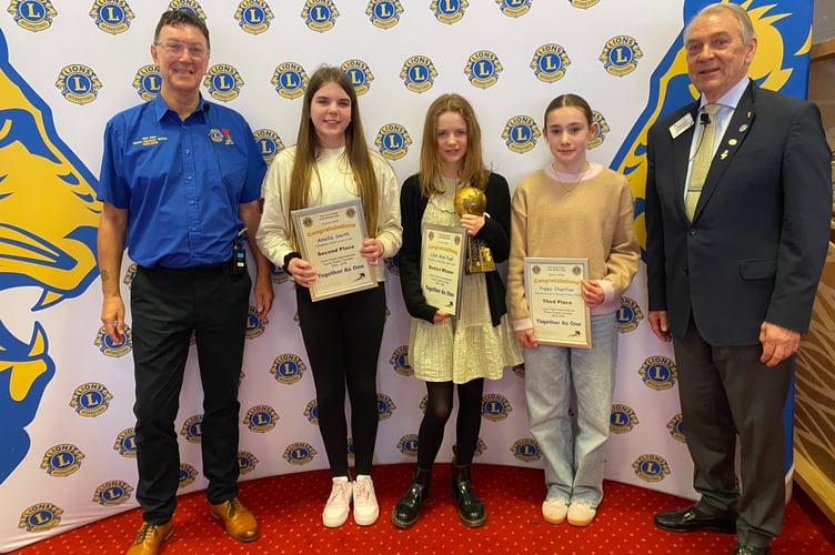 Lilah, centre, from Crediton, with the District Lions award with Amelia, second left, who was second and Poppy Charlton, fourth left, with the District Governor, left and International Director, right.
