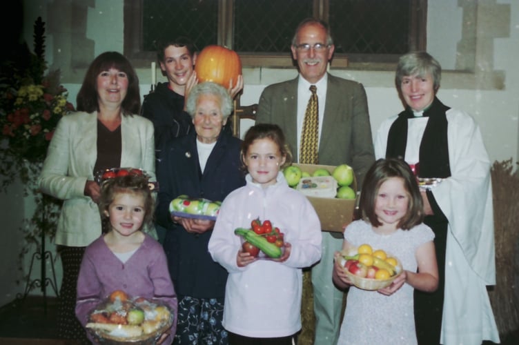 Some of the congregation at Coldridge Parish Church with harvest produce in September 2005. DSC01447