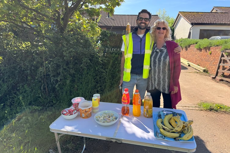 Waiting at one of the food stops to refill the cyclists.  AQ 8772
