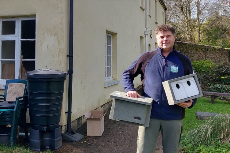Mark Baker, County Parks manager at the Grand Western Canal Country Park offices with swift nest boxes.