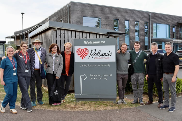 From left, Redlands partners Kirsty Conder and Jo Harris, David Seddon, Sandra Bu and husband Robert, sons Leon and Ivan, former GP Peter Twomey and Guy Wilson