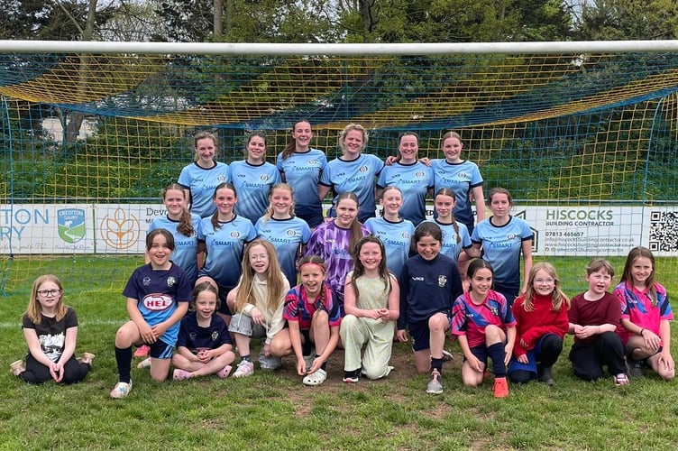 Crediton United ladies with Crediton Youth U9 girls who acted as mascots on April 19.

