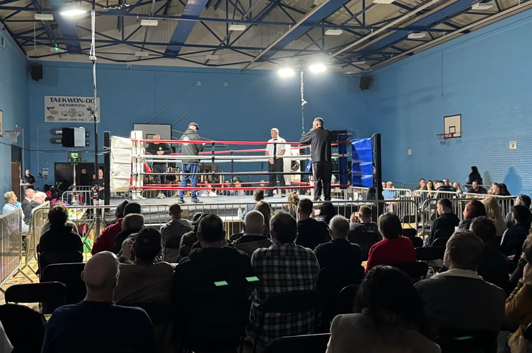 The ring and some of the crowd at the boxing show.  AQ 9412
