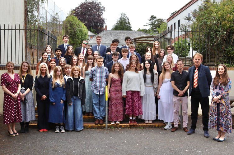 Year 13 students who won the QE Sixth Form Diploma Award with staff