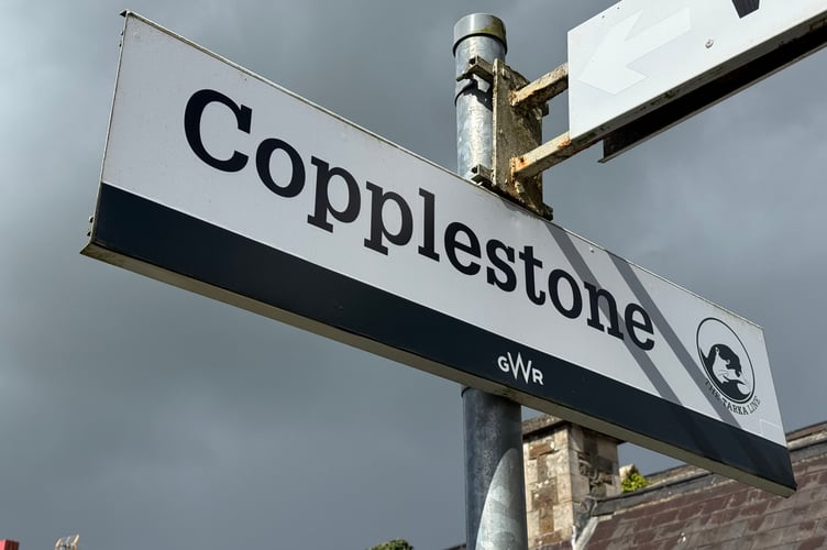 A railway station sign at Copplestone Railway Station. AQ 8115