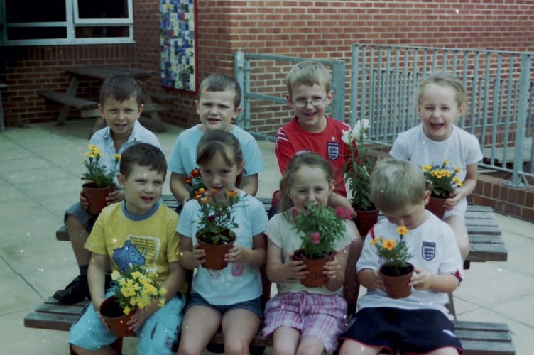 Hayward's School pupils with their planted flower pots, part of a large display at the school in July 2006. DSC01931