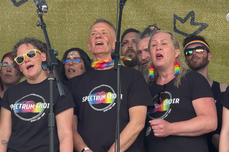 Some of the Spectrum Choir singers on the main stage at Exeter Pride.  AQ 0235