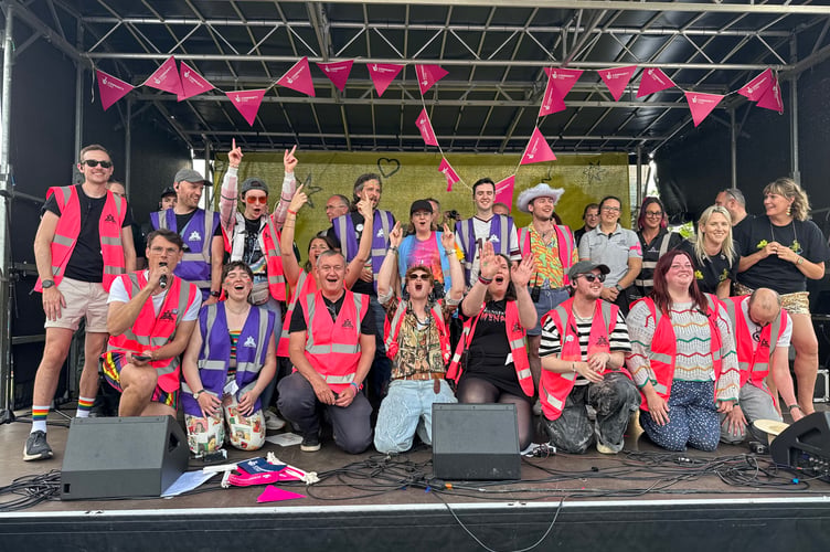 Exeter Pride organisers and volunteers, BSL interpreters and security on stage.  AQ 0406