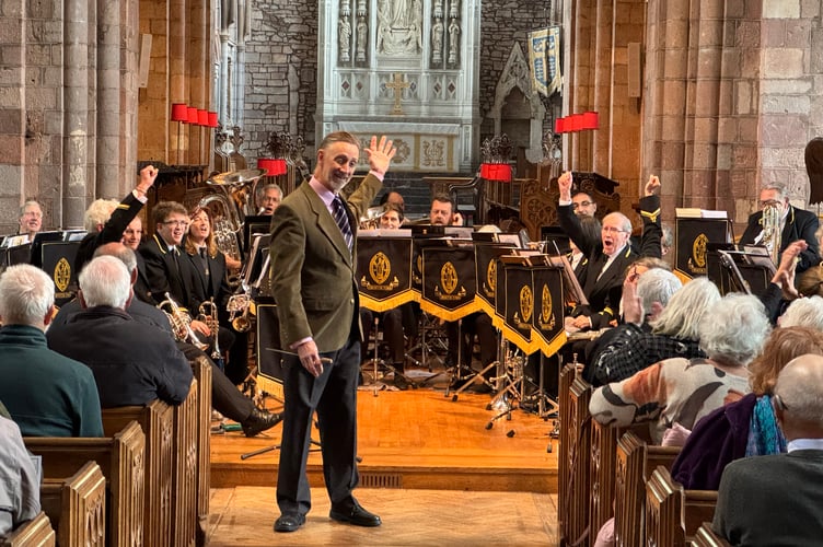 Musical Director Iorwerth Pugh with some of the members of Crediton Town Band. AQ 0902