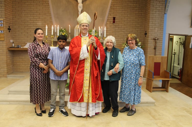 Bishop Nicholas with, left, Angelika Kuc, an altar server and right, the organist, and sacristan, Gwyneth Leonard. AQ 1518
