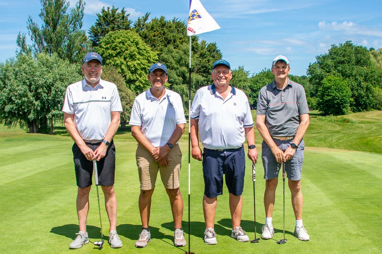 Gerald Abdoll, second left, with his team at the Captain’s Charity Day.
