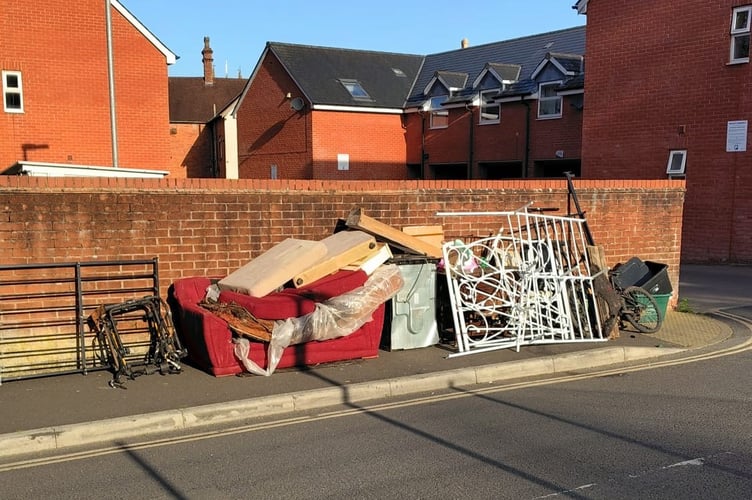 Rubbish dumped as part of a fly-tipping incident in Tiverton's Barrington Street