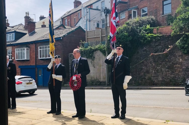 Henry Parker prepares to lay the wreath at Crediton Town and Hamlets War Memorial.
