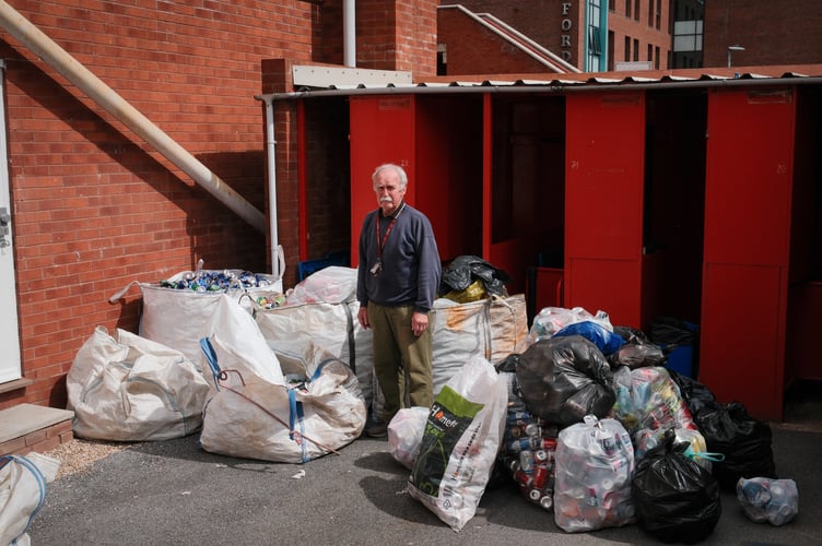 Andy Holloway with bags of cans collected at Exeter City FC.
