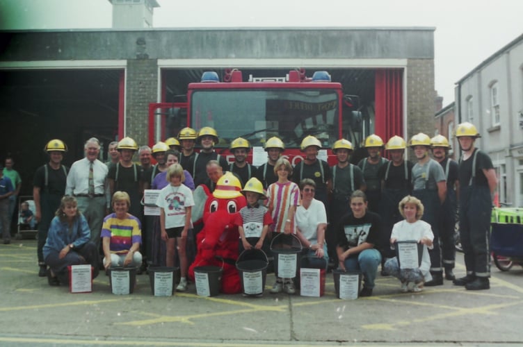 Firefighters who took part in a fire engine pull for charities with mascot Weliphant who met many children in August 1994. DSC00262