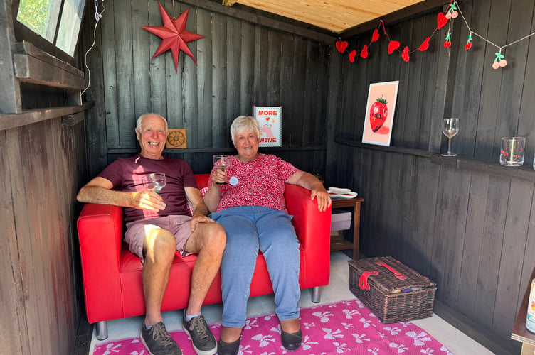 Roger and Margaret Field in their allotment shed. AQ 2303