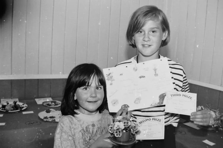 Abigail High (5) and Becky Dawe (11) were young prizewinners at Wembworthy Flower Show in August 1996. DSC00105