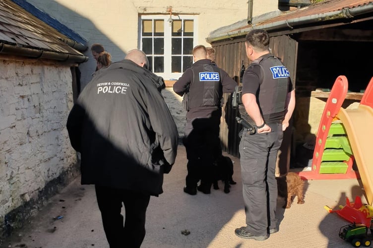 Officers carrying out warrant at Clayhanger property
