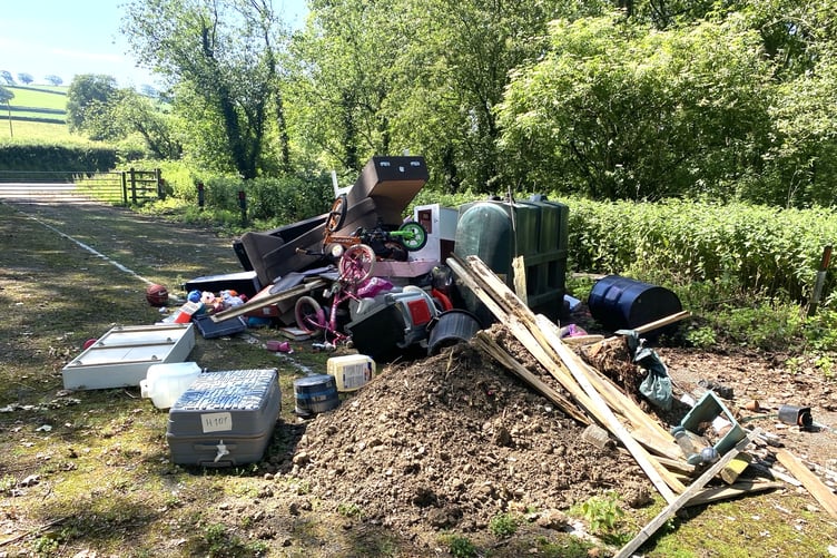 The fly-tipped rubbish blocking the M5 emergency access route at Little Copse.