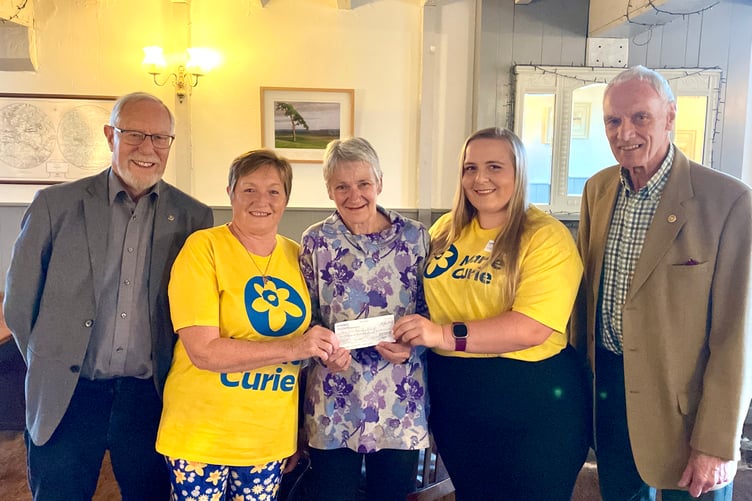From left, Fred Oliver, Gill Pearn of Marie Curie, Rotary President Jane Brimacombe, Lauren Derbyshire of Marie Curie, Garry Adams