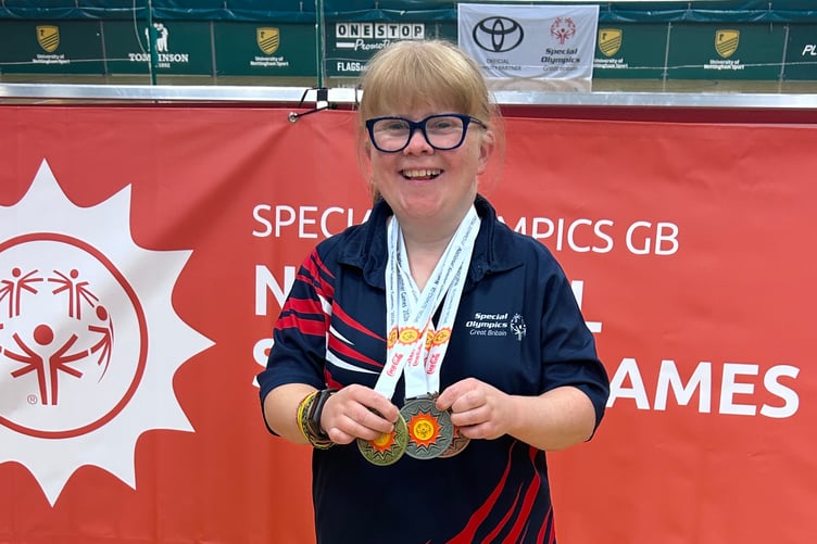 Dee with the Gold, Silver and Bronze medals.