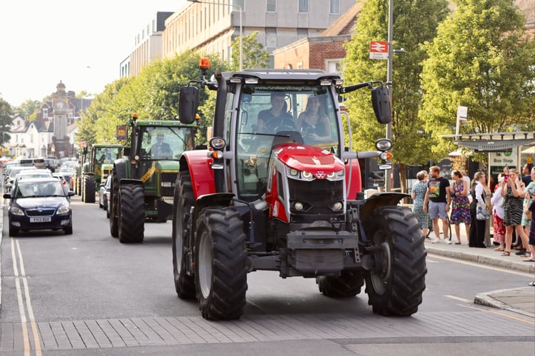 Tractors driving down Queen Street, Exeter