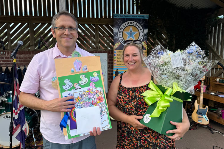 Hayward’s Headteacher Andy Smith presented Claire Lethbridge, chair of the PTA, who was stepping down after five years, with flowers and cards from each class at the school. AQ 3934