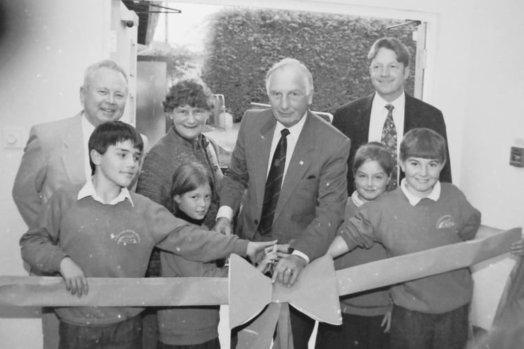 Pupils at Cheriton Bishop School help Devon County Councillor Ray Cook cut the ribbon to open their new classroom and facilities in October 1996. DSC00239
