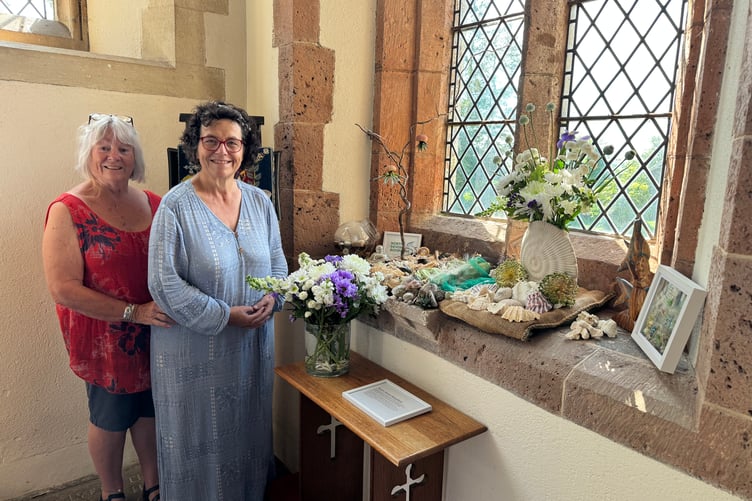 With one of the floral displays in Coldridge Church. AQ 3886