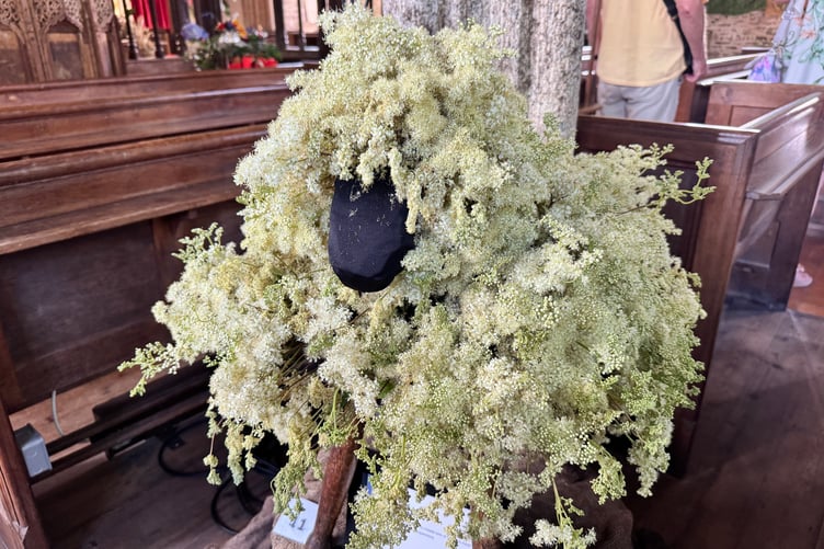 A sheep on display in the flower festival in Coldridge Parish Church. AQ 3977