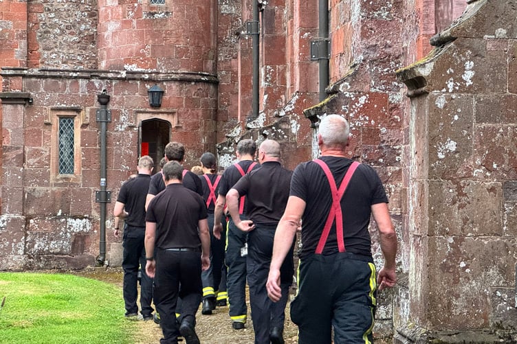 Firefighters prepare to visit the ringing chamber and tour part of the church roof. AQ 4575