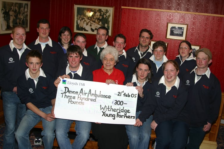 Following a bingo evening and carol singing Witheridge Young Farmers were able to present a cheque for £300 to Devon Air Ambulance representative Gillian Gunn in February 2005. 245-4503_IMG