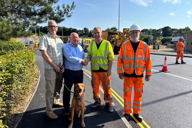 County Councillor Jim Cairney, second left, thanks Rick Dare, site foreman for iCivils and, right, Steve Palfrey, lead operative of Buko, for completing the works two weeks early, with, left, District Councillor John Downes. AQ 5107