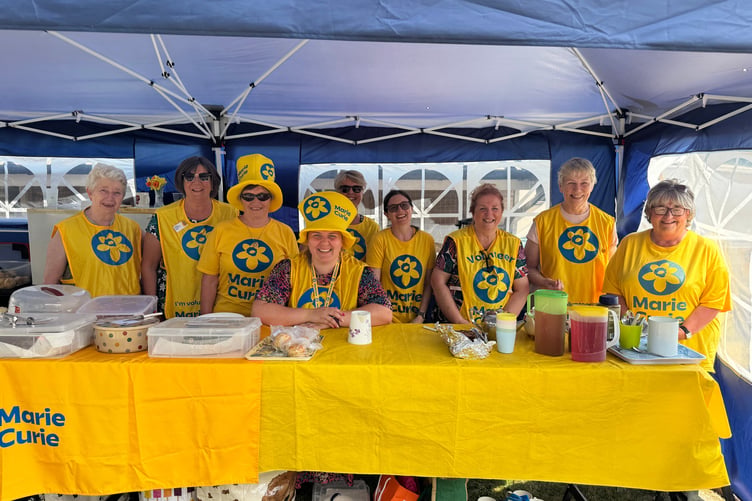 Marie Curie Crediton Fundraising Group helpers and volunteers at the tea party with Gill Pearn, chair, third left. AQ 4106
