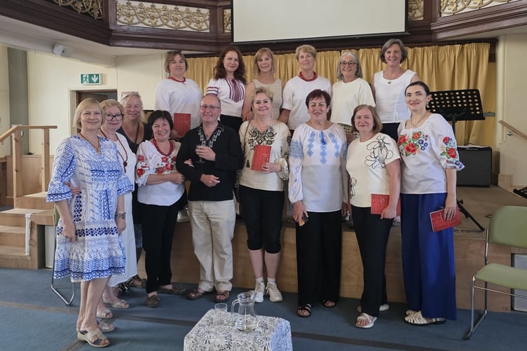 At the launch of the book Welcome In, stories and memories written by refugees and friends in Crediton.