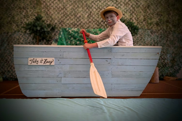 Ratty rowing his boat, Take It Easy, at Bow School.