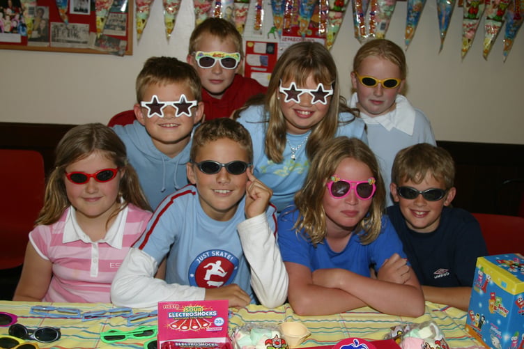 Cool pupils from Sandford School sold sunglasses on one of the stalls at the Strawberry Fair in July 2004. 198-9803_IMG
