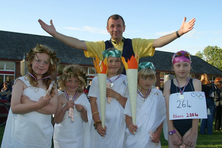 Hayward's School Summer Fair had an Olympic theme, pictured are fancy dress entrants with Benco, the children's entertainer who was judge in July 2004. 201-0118_IMG
