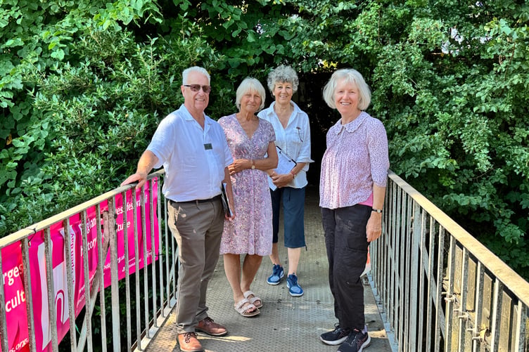 Crossing the Quicke family footbridge from Newton House to the churchyard and arboretum during the judging. AQ 4963