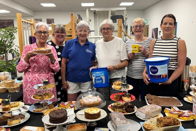 Members of the local FORCE Cancer Charity support group and staff from Dolphin Stairlifts and Mobility Solutions at the bake sale. AQ 5397