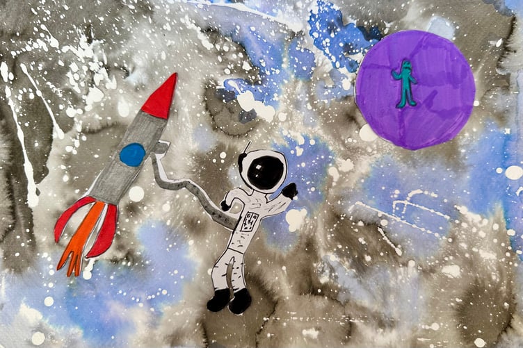 Winner Lily-Ann in year five at Cheriton Fitzpaine Primary School's artwork shows an astronaut and an alien sharing a wave